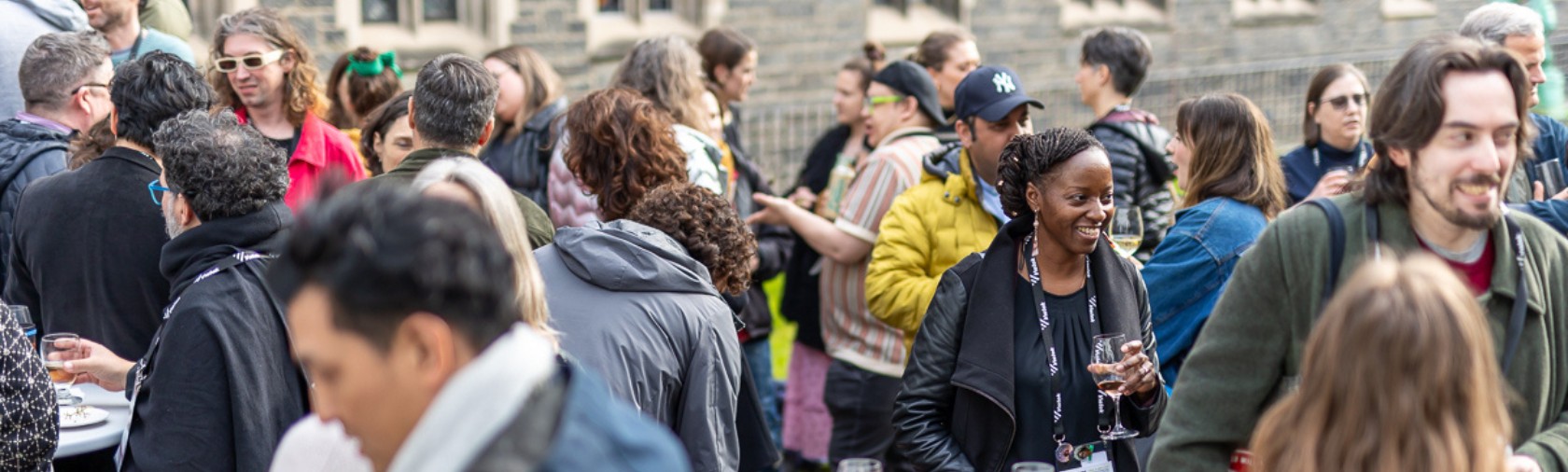 Delegates networking outside Hart House in Toronto