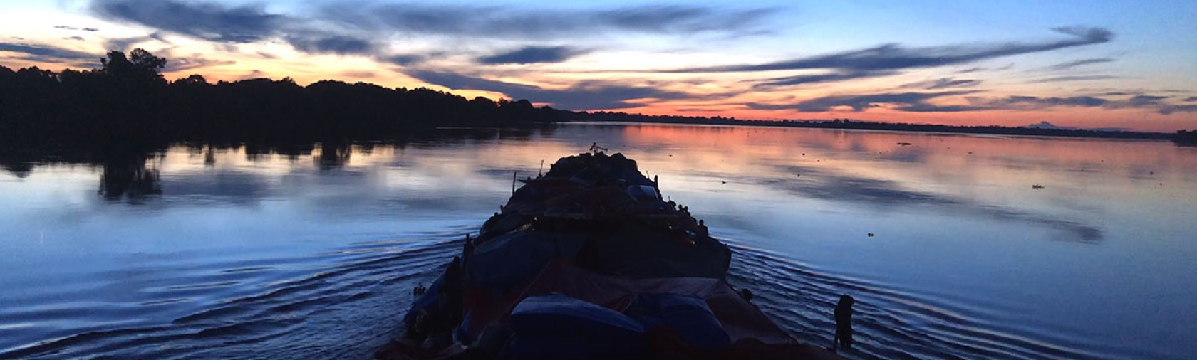 Front of boat at sunset