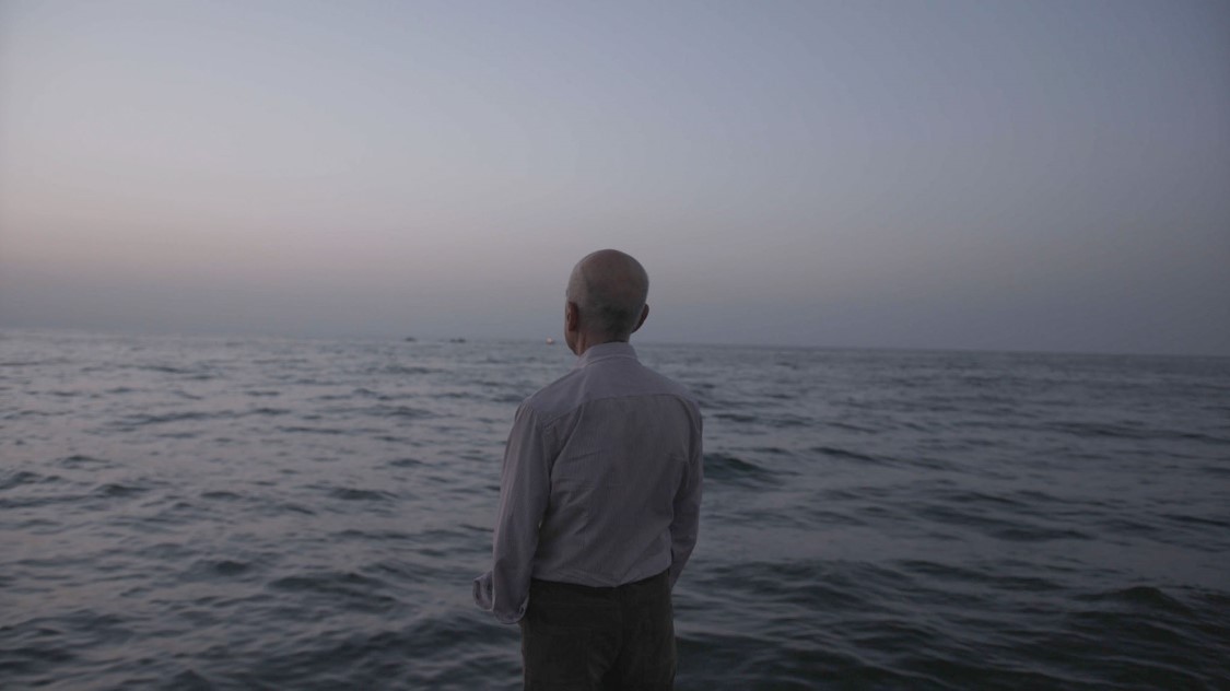 Man staring at ocean