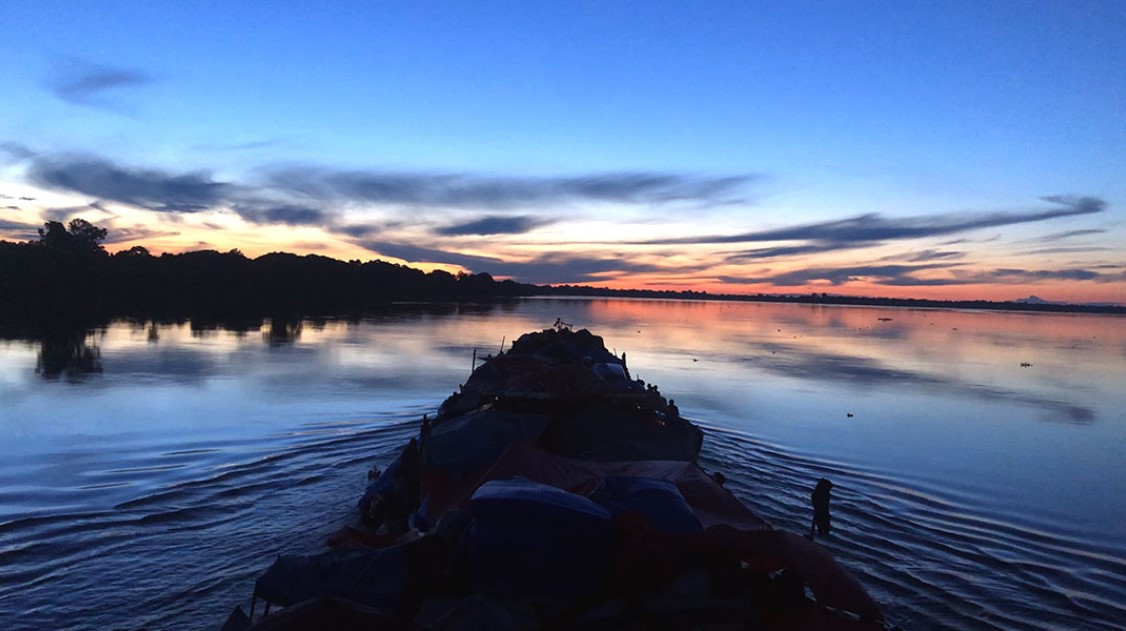 Front of a boat at sunset