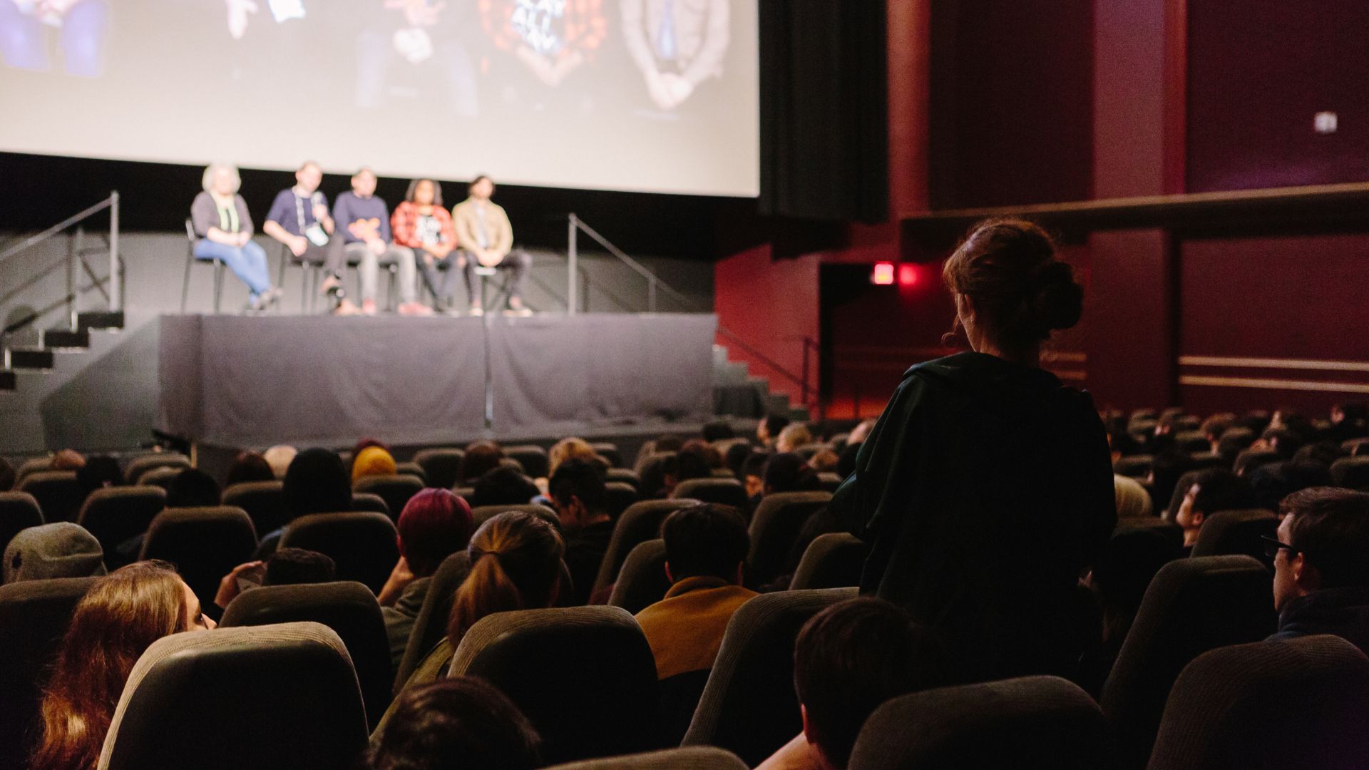 A student asks a question following a Docs For Schools screening